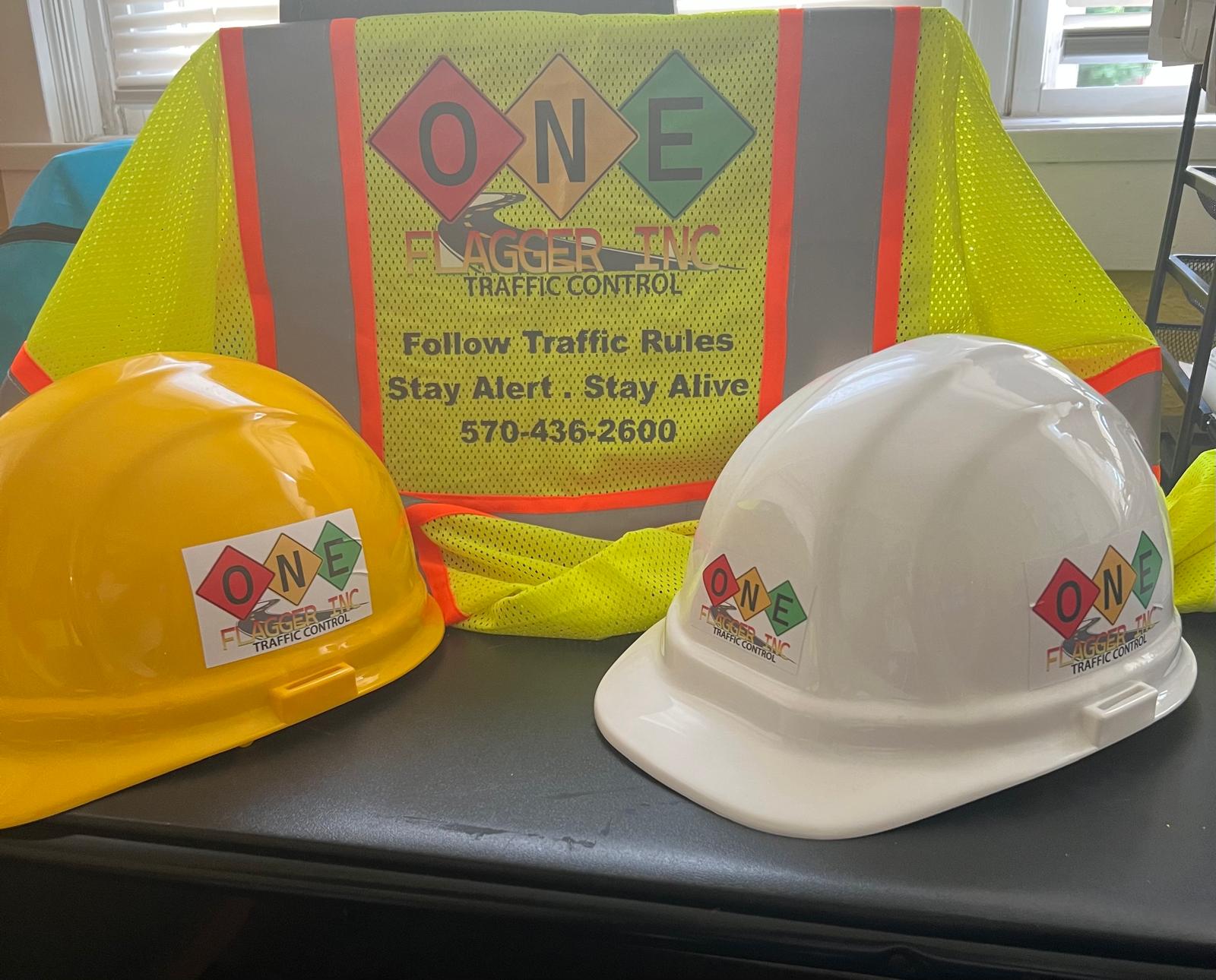 One Flagger Inc branded hardhat and safety vest